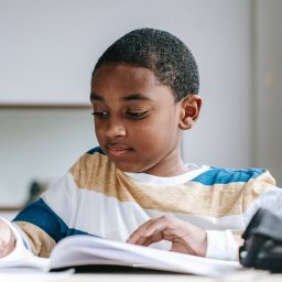 Young boy doing schoolwork.