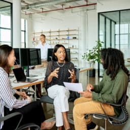 Coworkers talking in a small group