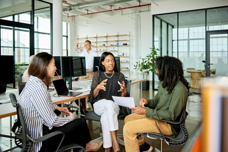 Coworkers talking in a small group